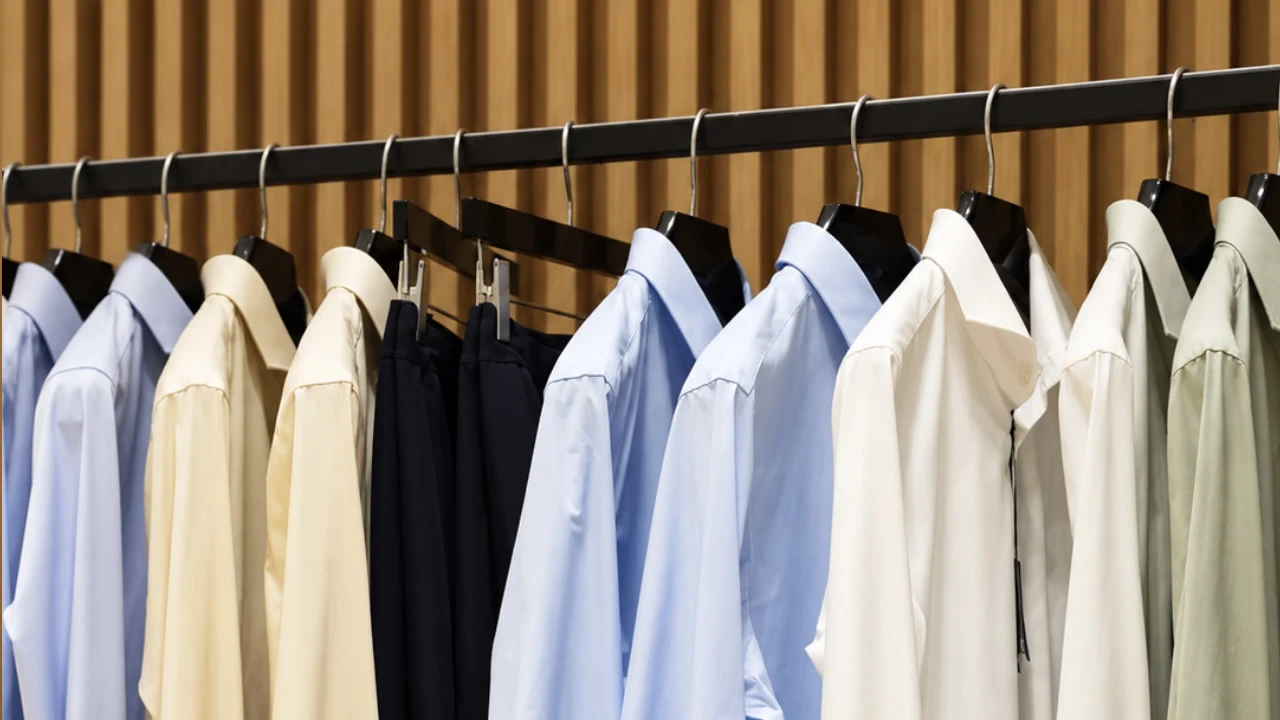 Shirts on hangers in an AVENUE boutique